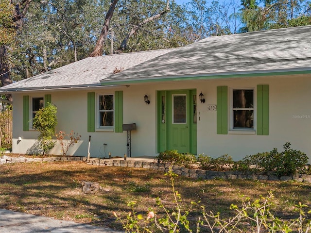 ranch-style house with a front yard