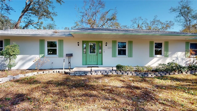 ranch-style house with stucco siding