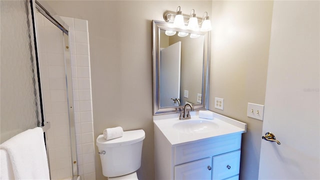 full bathroom with a shower, vanity, and toilet