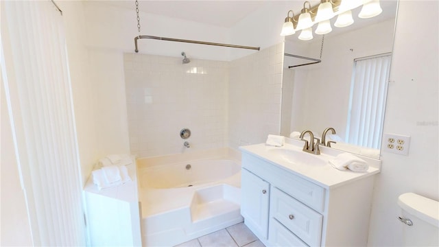 bathroom featuring toilet, vanity, bathtub / shower combination, and tile patterned floors