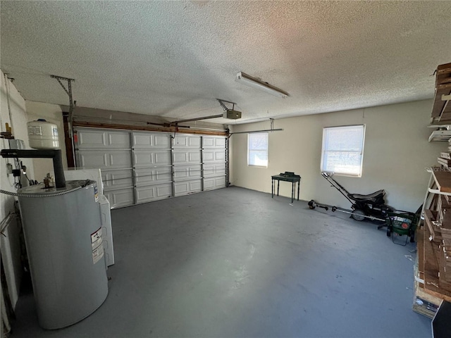 garage featuring electric water heater and a garage door opener