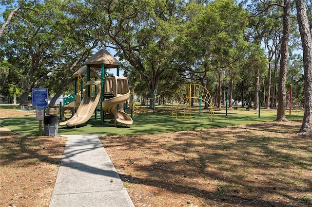 communal playground featuring a yard