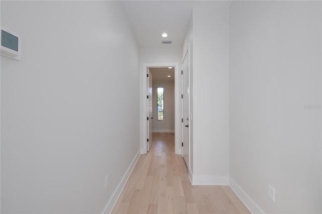 hall with light hardwood / wood-style flooring