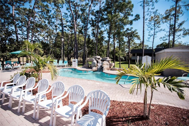 view of pool featuring a patio