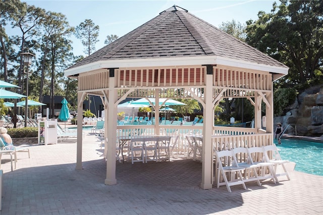 exterior space featuring a community pool and a gazebo