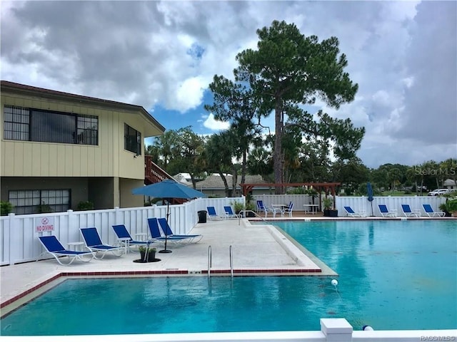 view of swimming pool with a patio area