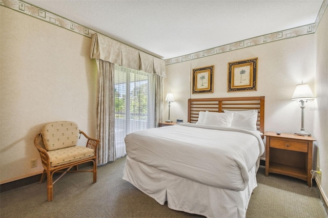 carpeted bedroom featuring a textured ceiling