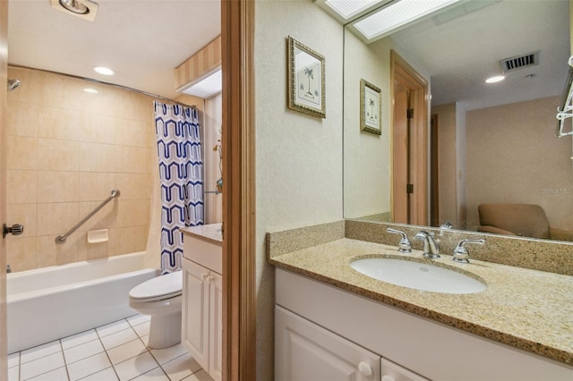 full bathroom featuring shower / bath combo with shower curtain, tile patterned flooring, vanity, and toilet