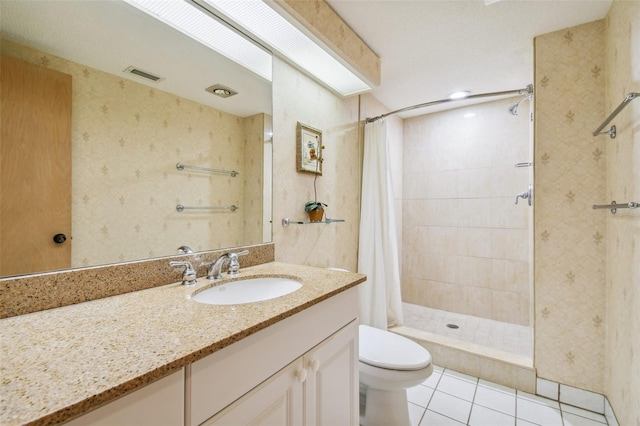36750 US Highway 19 N Unit 22208, Palm Harbor, FL 34684 - bathroom with toilet, vanity, a shower stall, tile patterned flooring, and visible vents