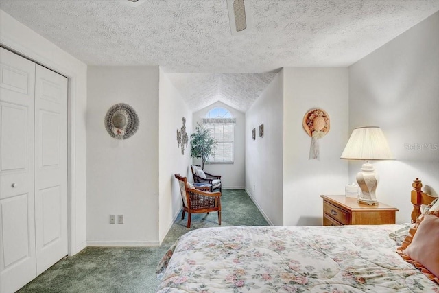 carpeted bedroom featuring ceiling fan, a closet, a textured ceiling, and lofted ceiling