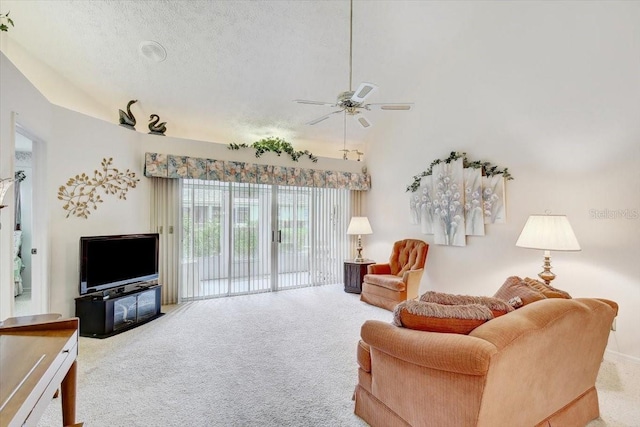 living room featuring a textured ceiling, high vaulted ceiling, ceiling fan, and carpet flooring