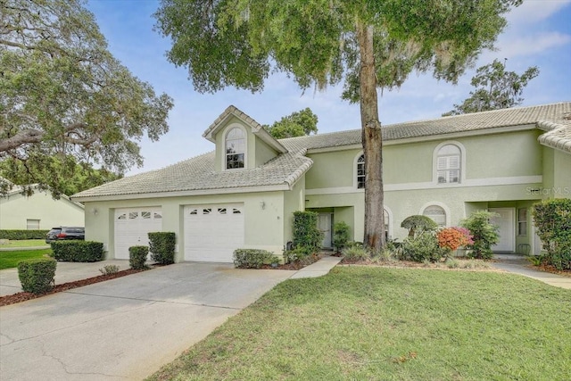 view of front facade featuring a front yard and a garage