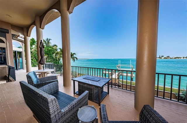 exterior space featuring an outdoor living space and a water view