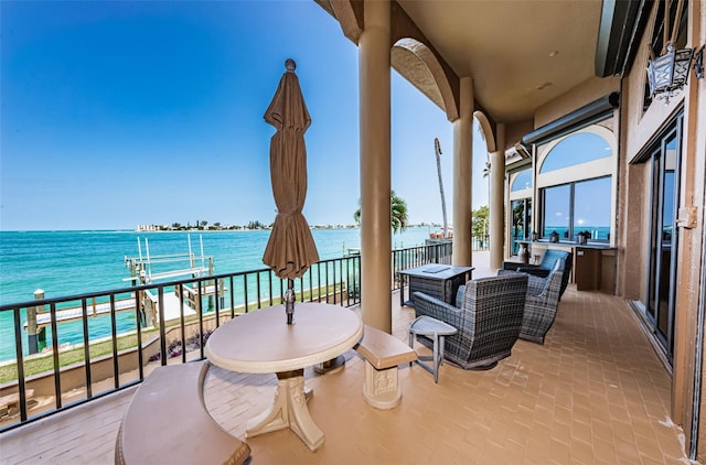 balcony featuring a water view