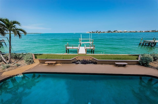 view of pool with a boat dock and a water view