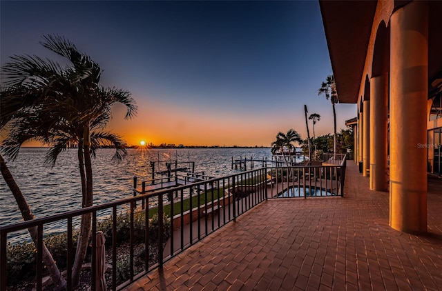 exterior space with a balcony and a water view