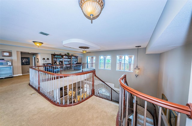 hallway with carpet floors