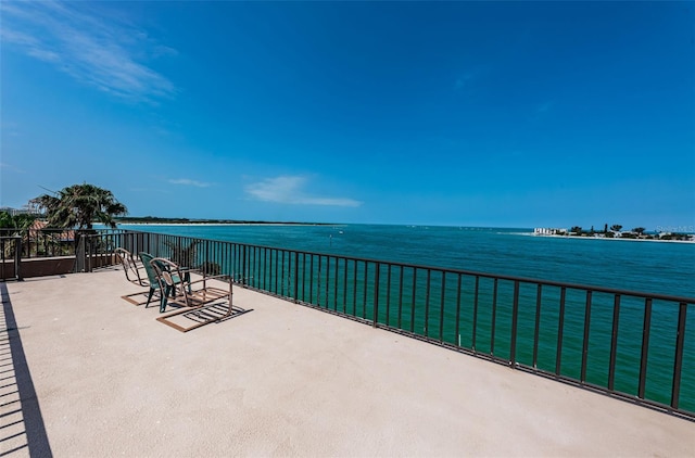 view of terrace featuring a water view