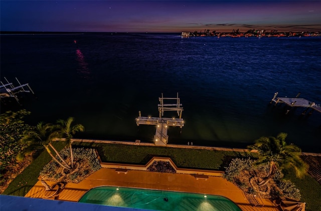 view of pool with a water view