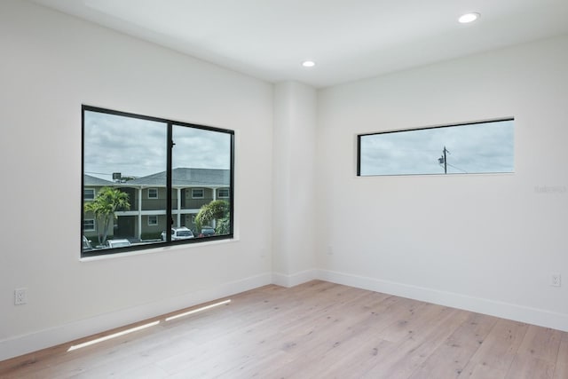 spare room with light wood-type flooring