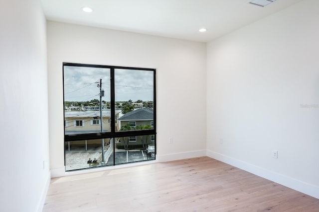 spare room with light wood-type flooring