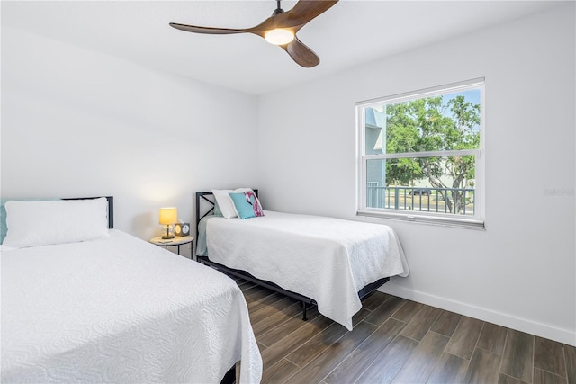 bedroom featuring ceiling fan and dark hardwood / wood-style flooring