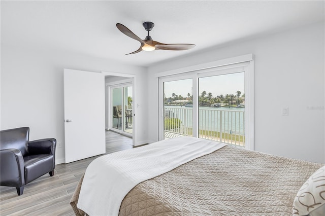 bedroom with access to outside, ceiling fan, and hardwood / wood-style floors