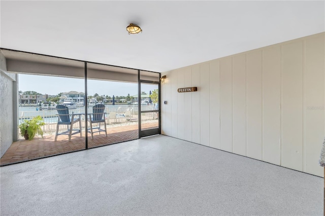 unfurnished room featuring plenty of natural light