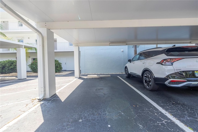 garage featuring a carport