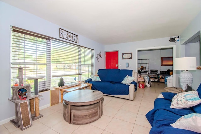 living room featuring light tile patterned floors and a healthy amount of sunlight