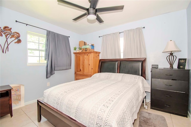 bedroom with ceiling fan and light tile patterned flooring