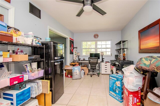 tiled office space with ceiling fan