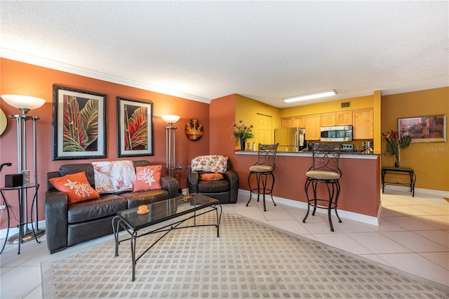 living room featuring crown molding, a textured ceiling, and light tile floors