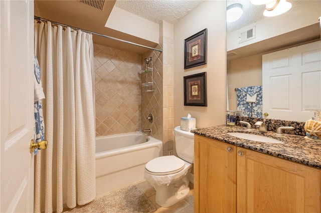 full bathroom featuring shower / bathtub combination with curtain, a textured ceiling, tile floors, large vanity, and toilet