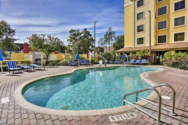 view of swimming pool featuring a patio