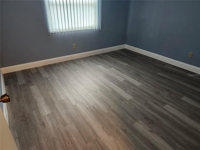 spare room featuring hardwood / wood-style flooring