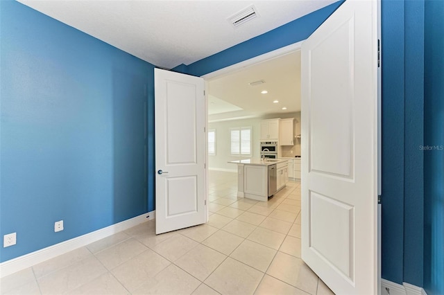 empty room with light tile flooring