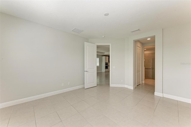 view of tiled spare room