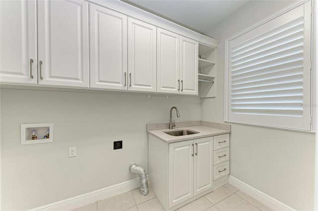 clothes washing area featuring cabinets, light tile flooring, washer hookup, sink, and hookup for an electric dryer