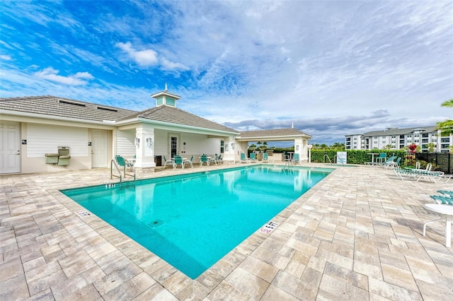 view of swimming pool with a patio