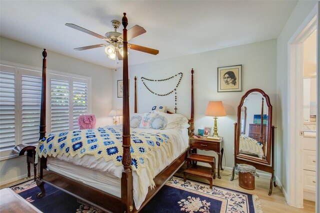 bedroom featuring light hardwood / wood-style flooring, ceiling fan, and ensuite bathroom