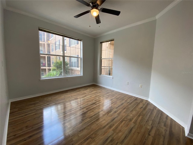 spare room featuring ornamental molding, ceiling fan, and dark hardwood / wood-style floors