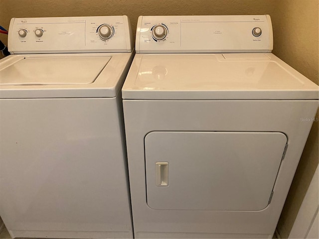 laundry area with washing machine and dryer