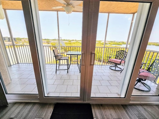 entryway featuring hardwood / wood-style flooring and ceiling fan