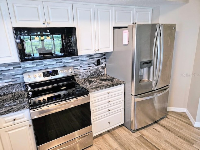 kitchen featuring white cabinetry, backsplash, and stainless steel appliances