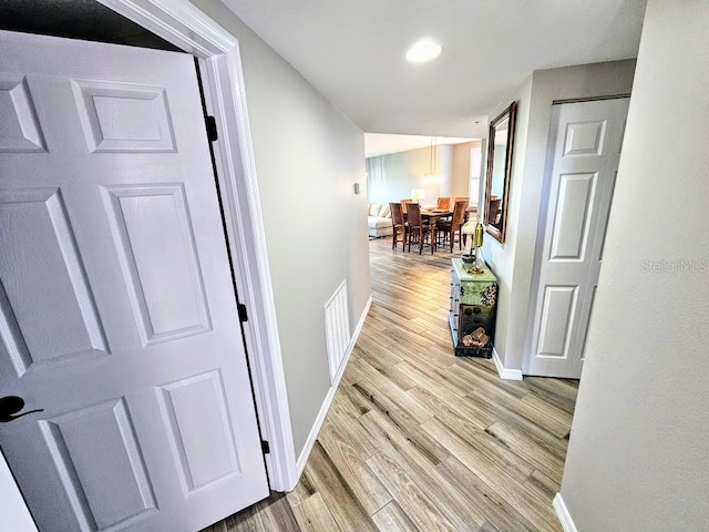 hall with light wood-type flooring