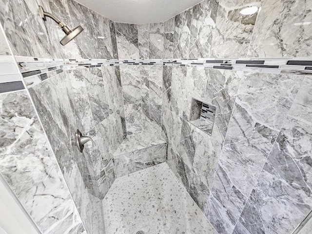 bathroom featuring tiled shower