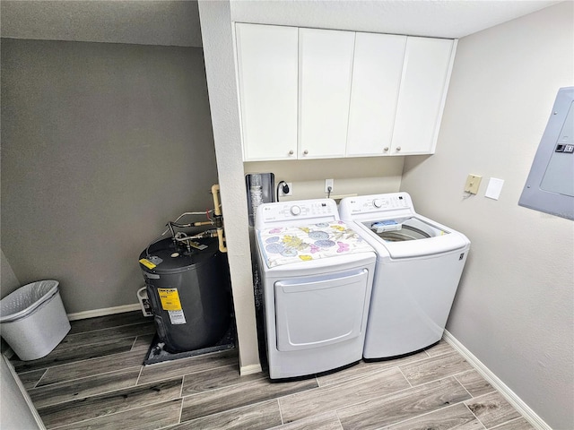 washroom featuring washer and dryer, hookup for an electric dryer, and cabinets