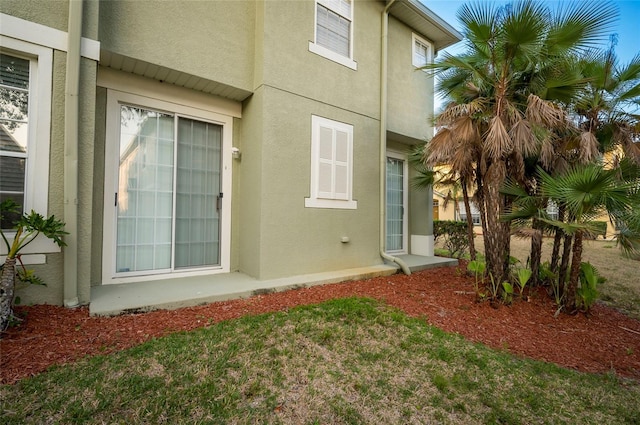 view of side of home with a lawn