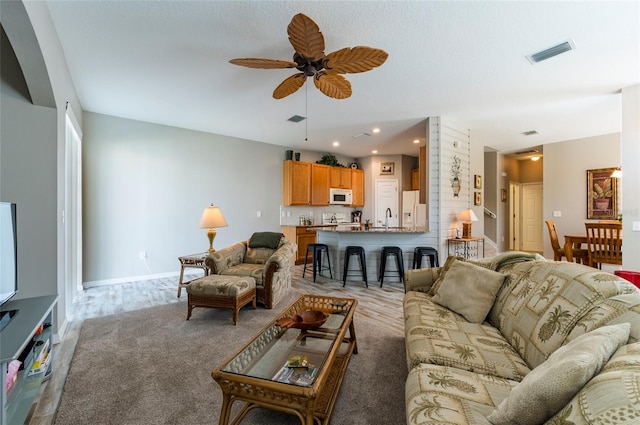 living room featuring ceiling fan